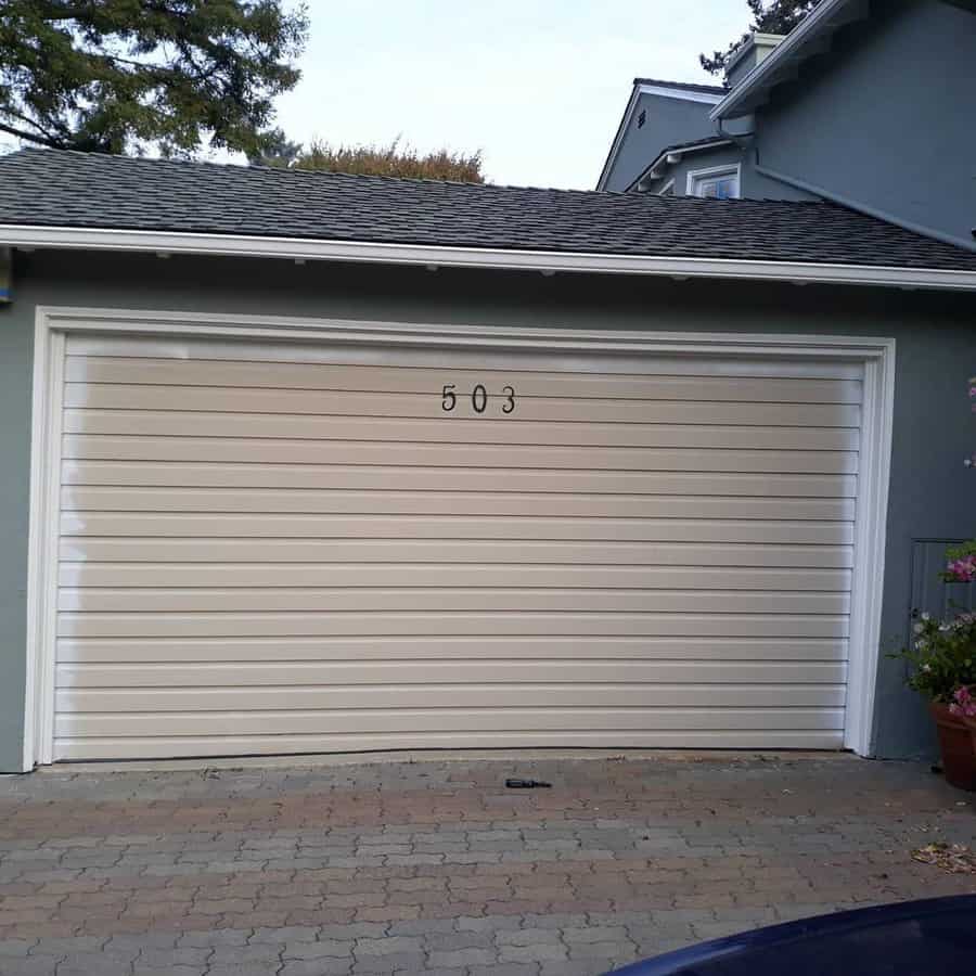 Beige Garage Door With House Number