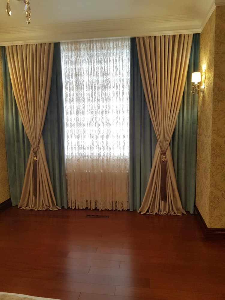 Luxurious drapes with sheer lace in a classic room