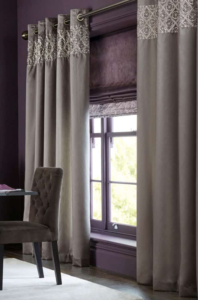 Dramatic purple room with elegant gray drapes