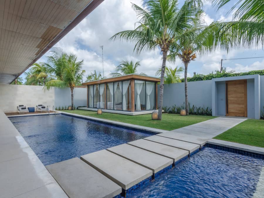 Tropical pool with glass cabana