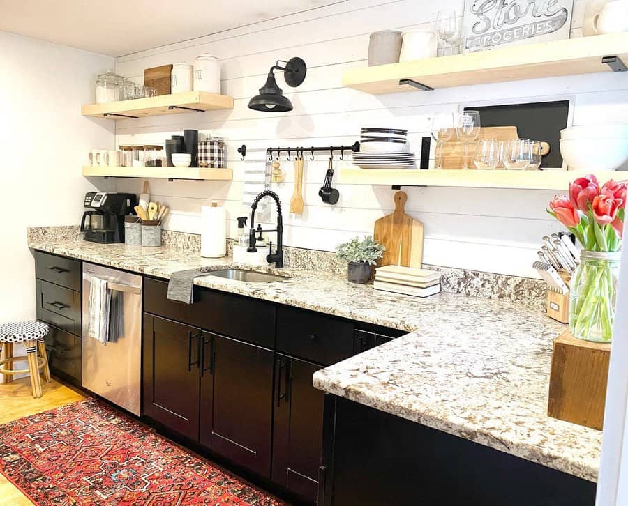 Modern kitchen with open shelving and dark cabinets