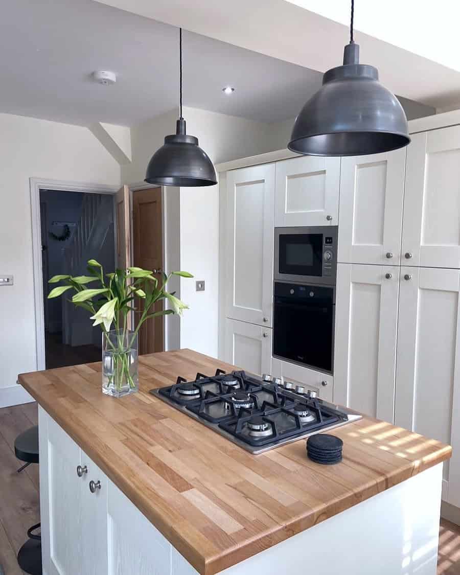 Farmhouse kitchen with metal pendants