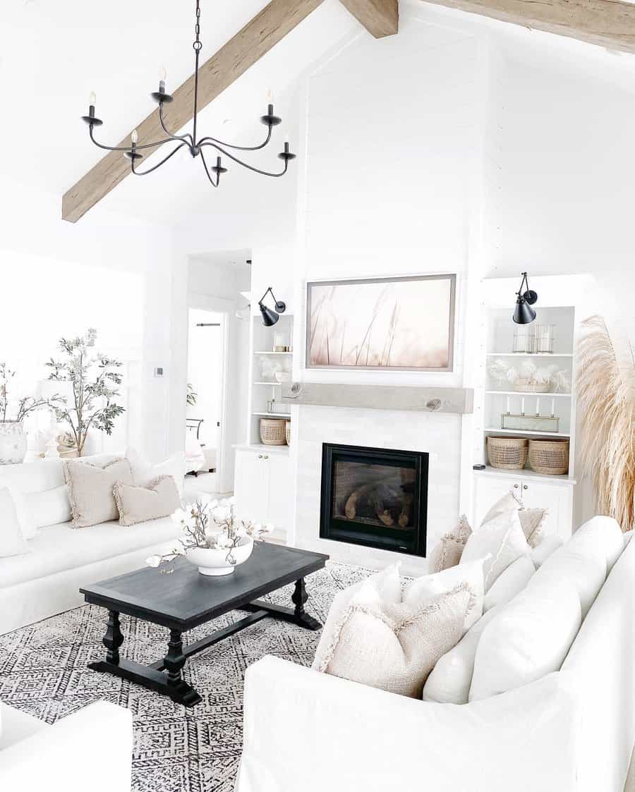 White living room with fireplace and white flowers