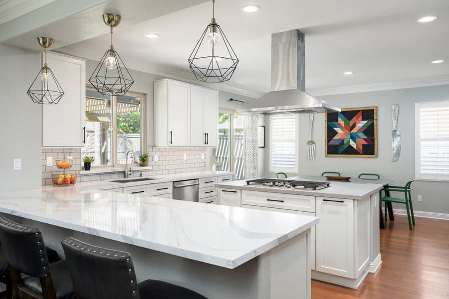 Bright kitchen with wireframe pendants and colorful accents