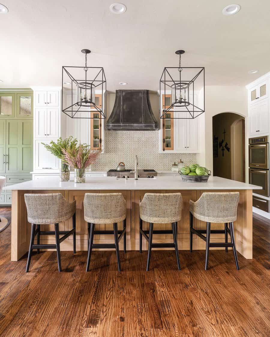 Transitional kitchen with caged pendants and wood accents