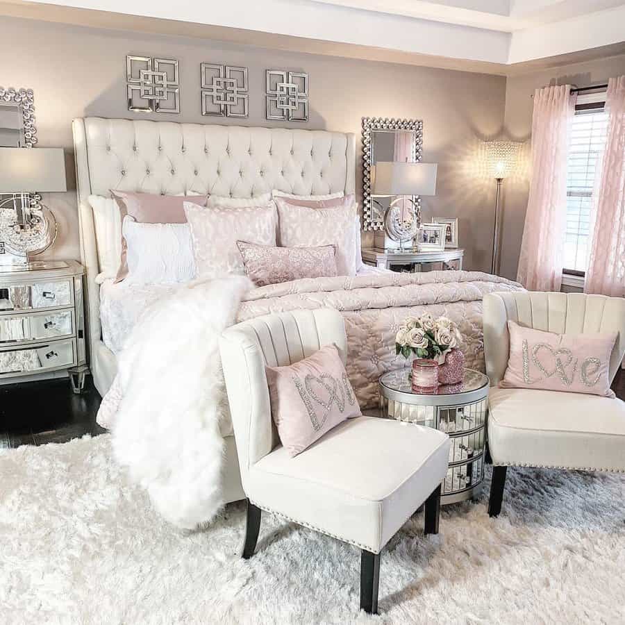 Plush white and pink bedroom with tufted headboard