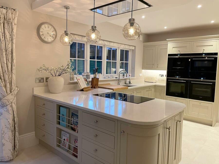 Modern kitchen with teardrop glass pendants and wood accents