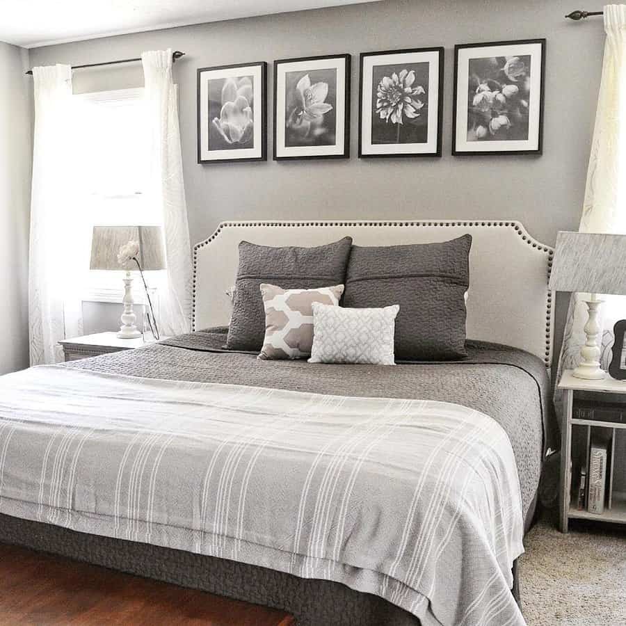 Neutral-toned bedroom with elegant floral wall art and gray bedding