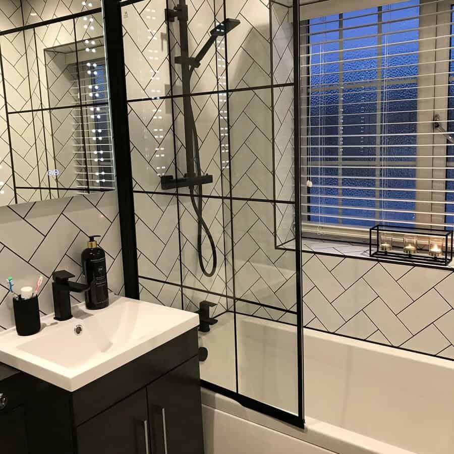 Small bathroom with grey herringbone walls