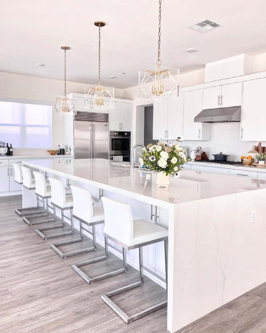 Contemporary kitchen with geometric hanging lights and large island