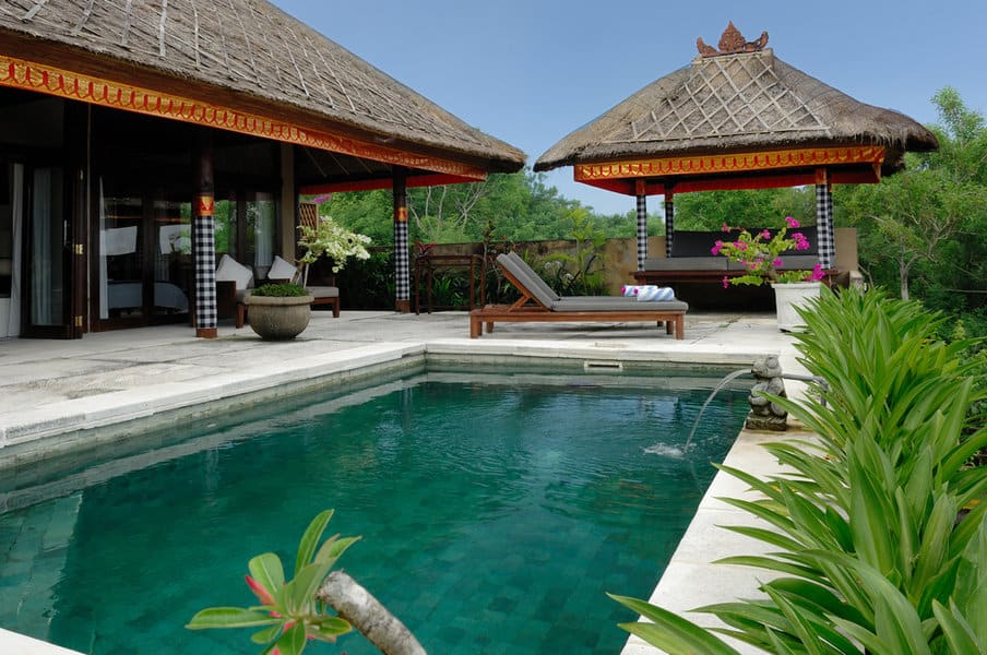 Balinese style pool villa with thatched cabana