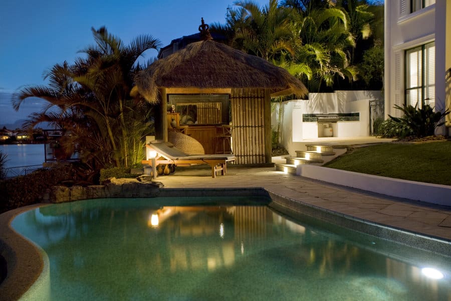 Evening by the pool with a tropical hut