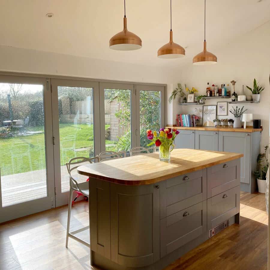 Sunny kitchen with wooden accents and garden view