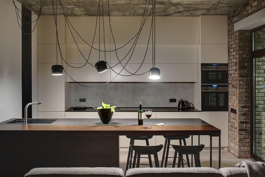 Chic industrial kitchen with unique pendant wiring