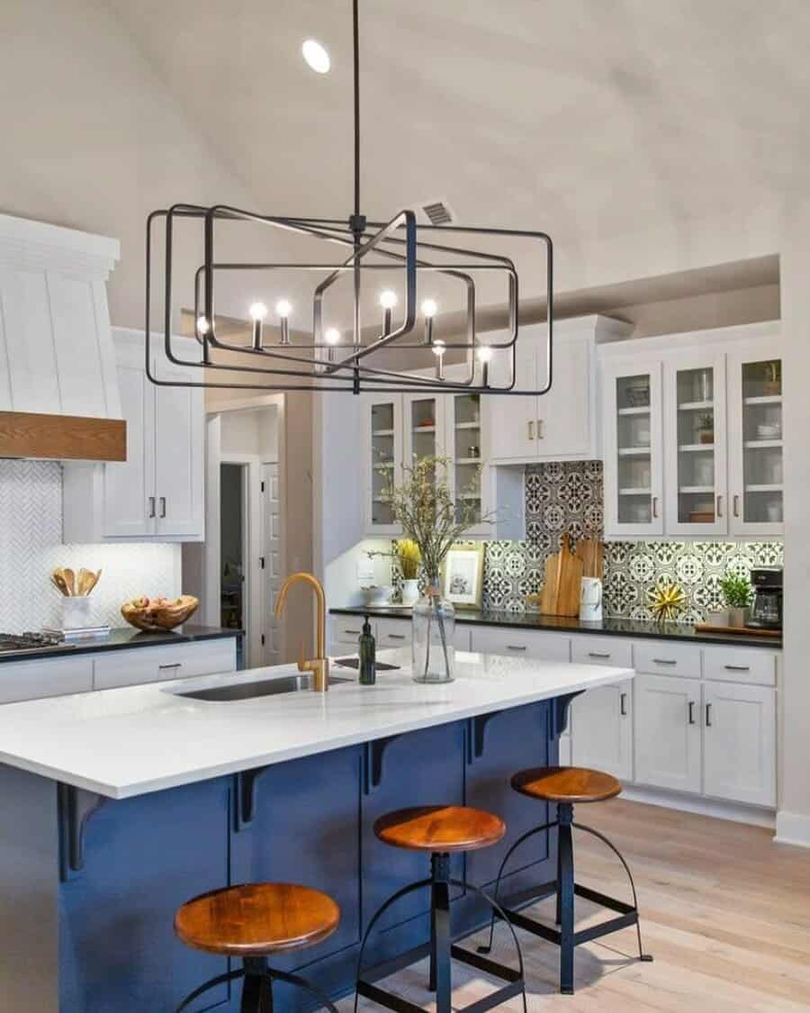 Contemporary kitchen with bold frame pendants and blue island