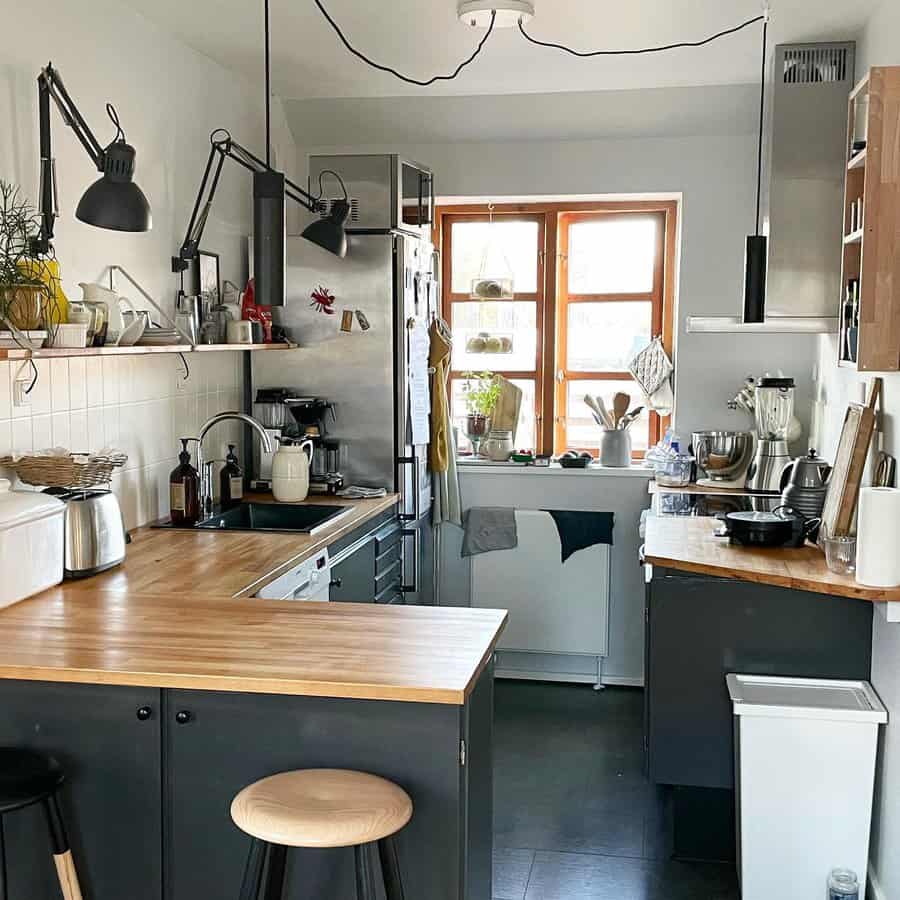 Small industrial-style kitchen with black accents and wood countertops