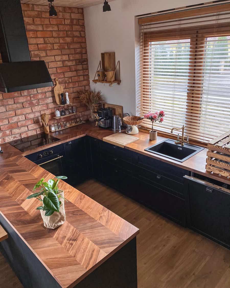 Rustic kitchen with brick wall and dark cabinets