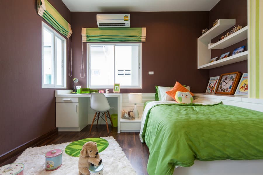 Bright childs bedroom with green accents and study area