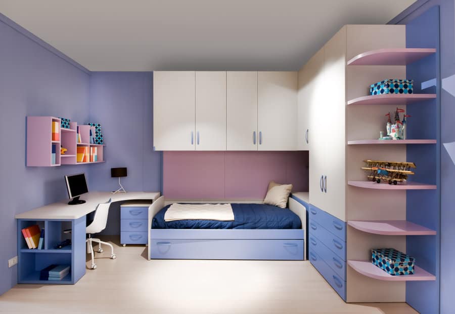 Organized kids bedroom with blue furniture and purple accents