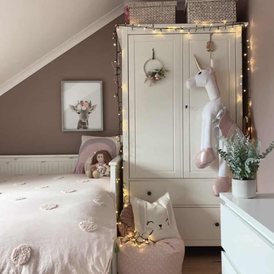 Charming kids room with fairy lights and soft pink accents