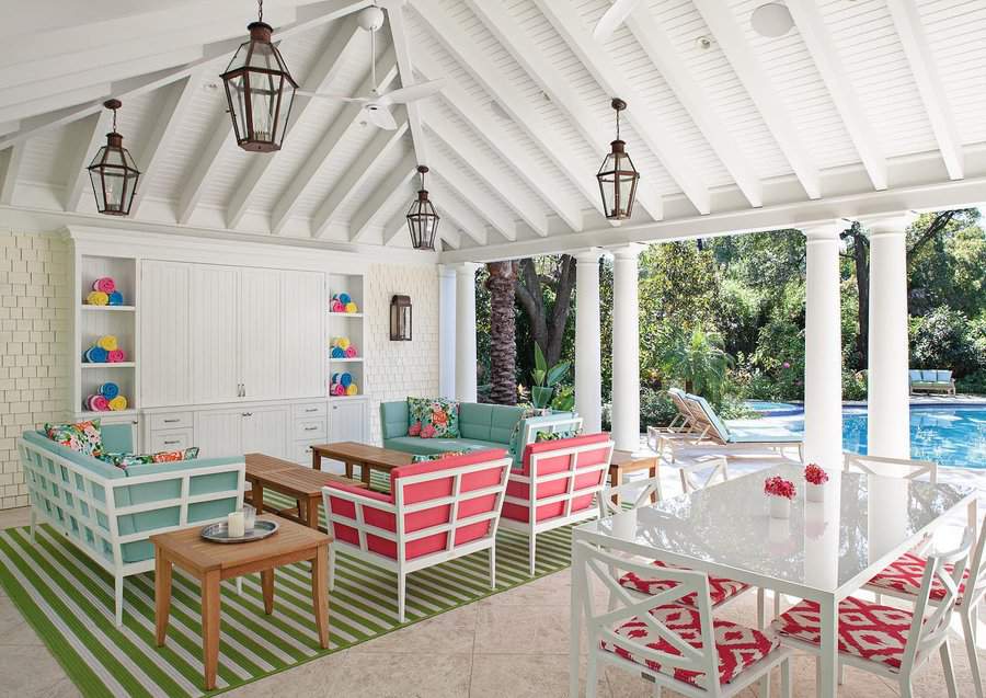 Bright pool cabana with colorful furniture