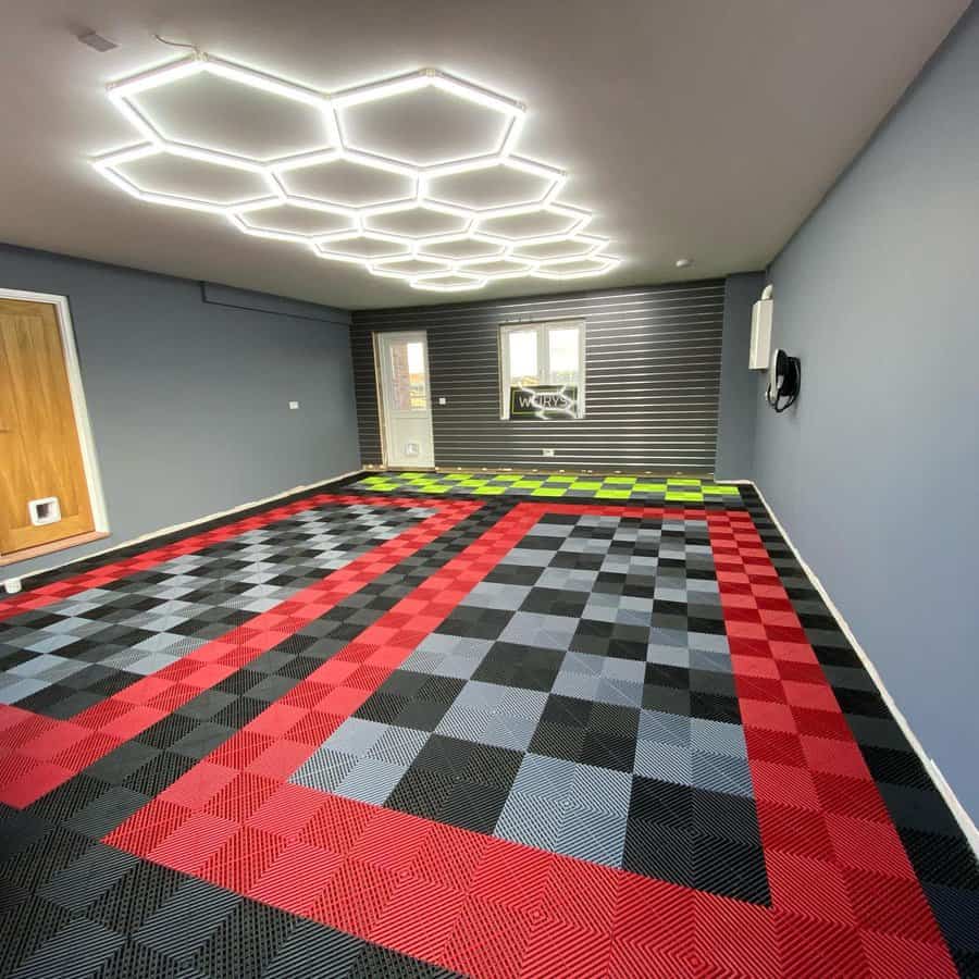 Modern garage with a checkered floor and hexagonal light fixtures