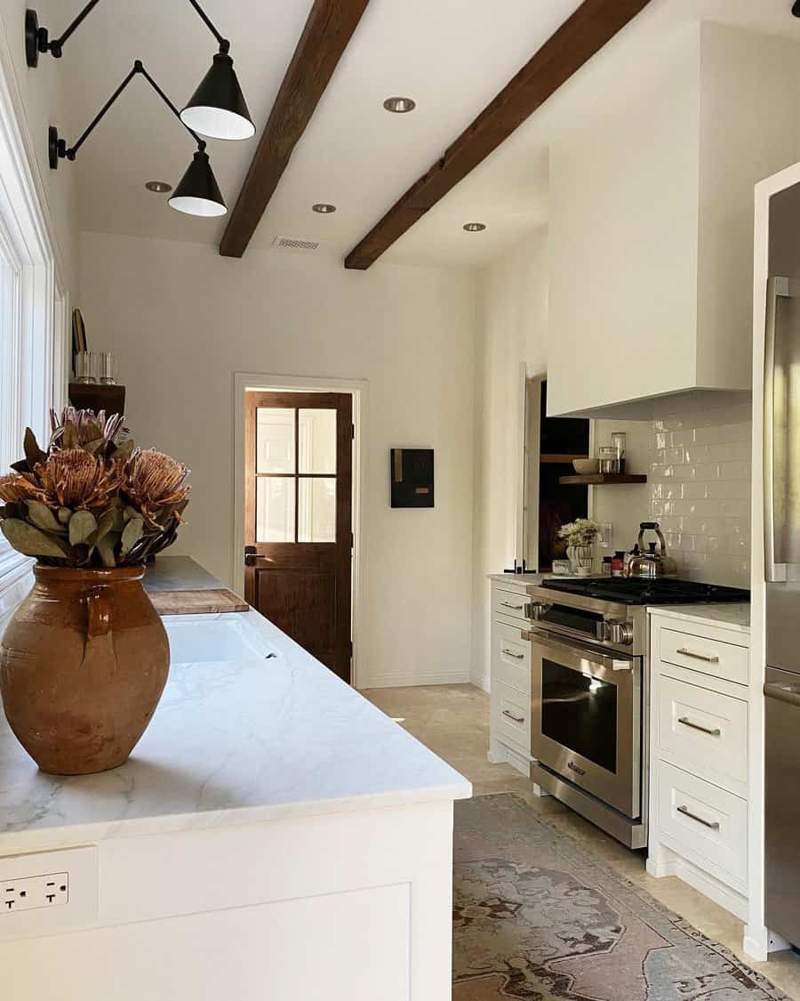 Spacious kitchen with vaulted ceiling and beams