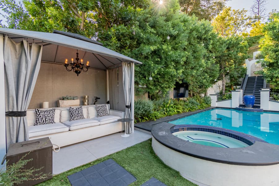 Elegant outdoor cabana by pool and spa