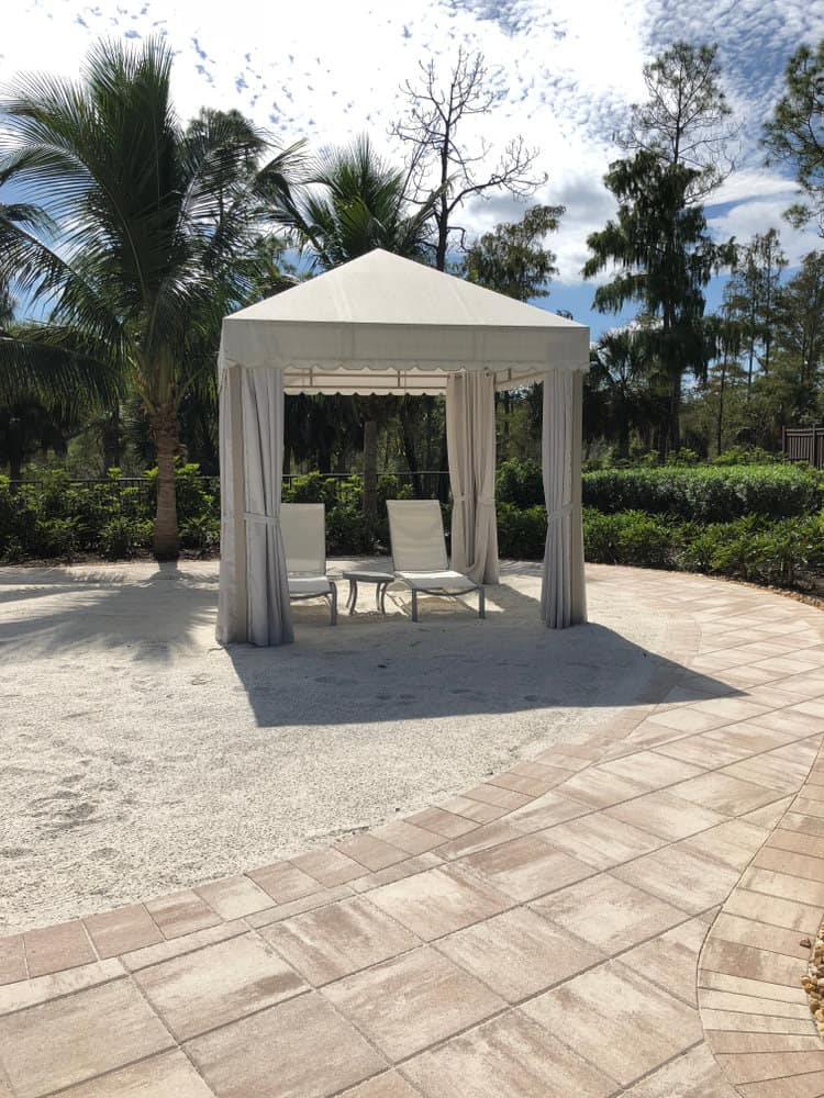 Simple white garden gazebo with chairs