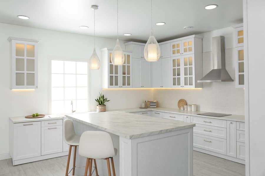 Airy kitchen with teardrop pendants and a bright window