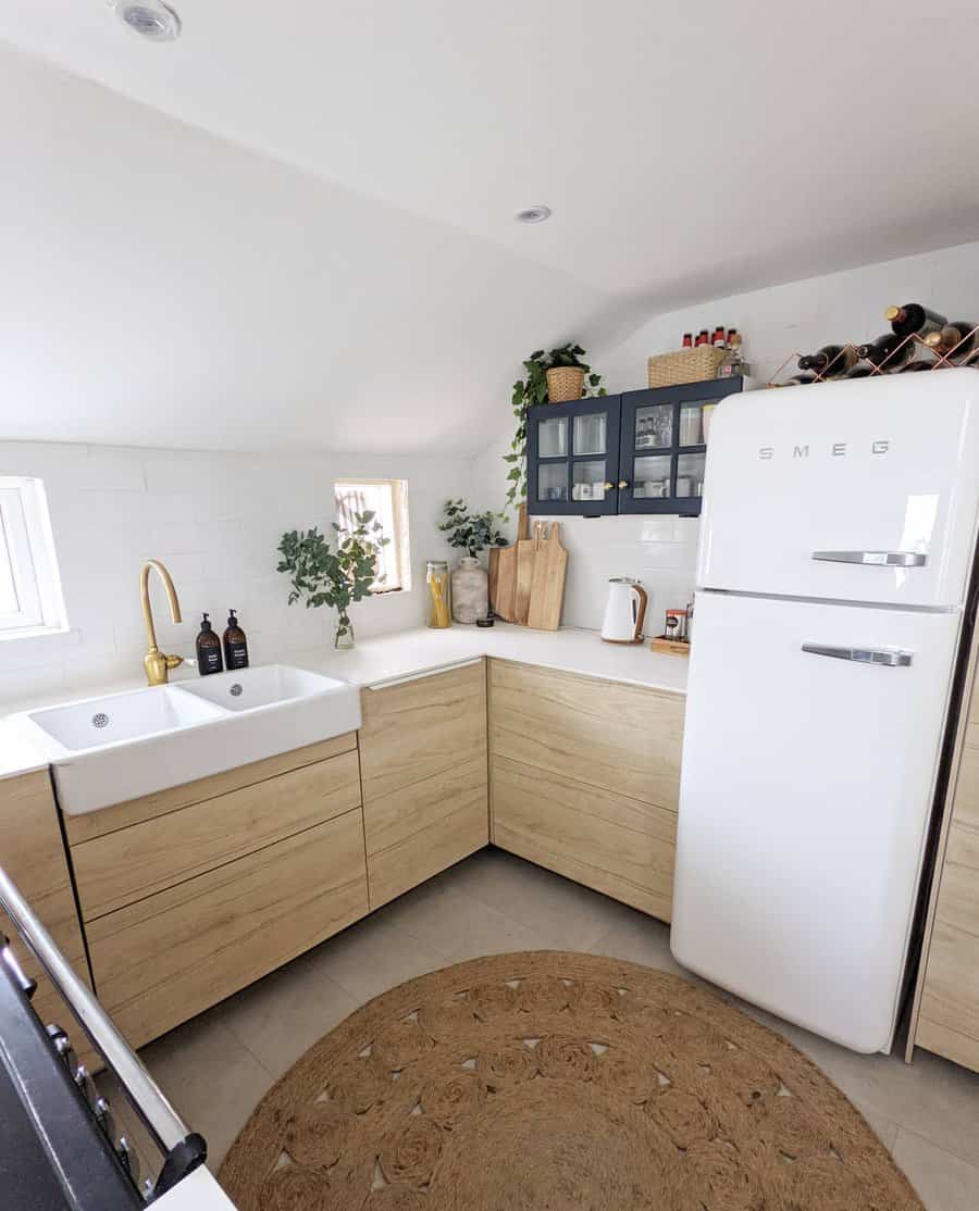 Scandinavian kitchen design with light wood and white appliances