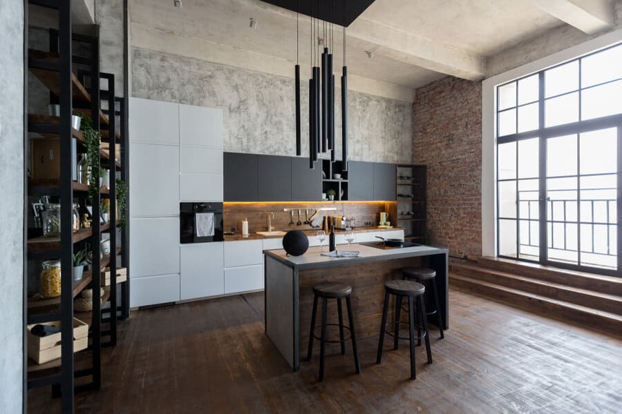 Loft style kitchen with cylinder pendants and large window