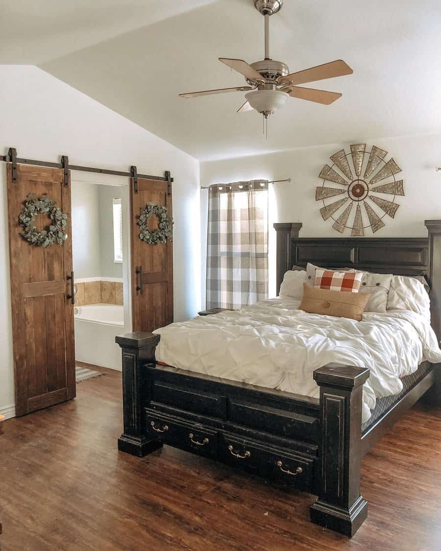 Rustic bedroom with barn door closets and farmhouse decor