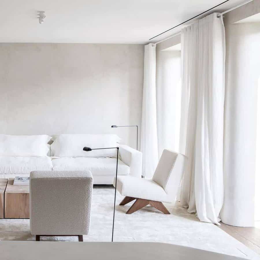 white living room with white and light grey furnishings