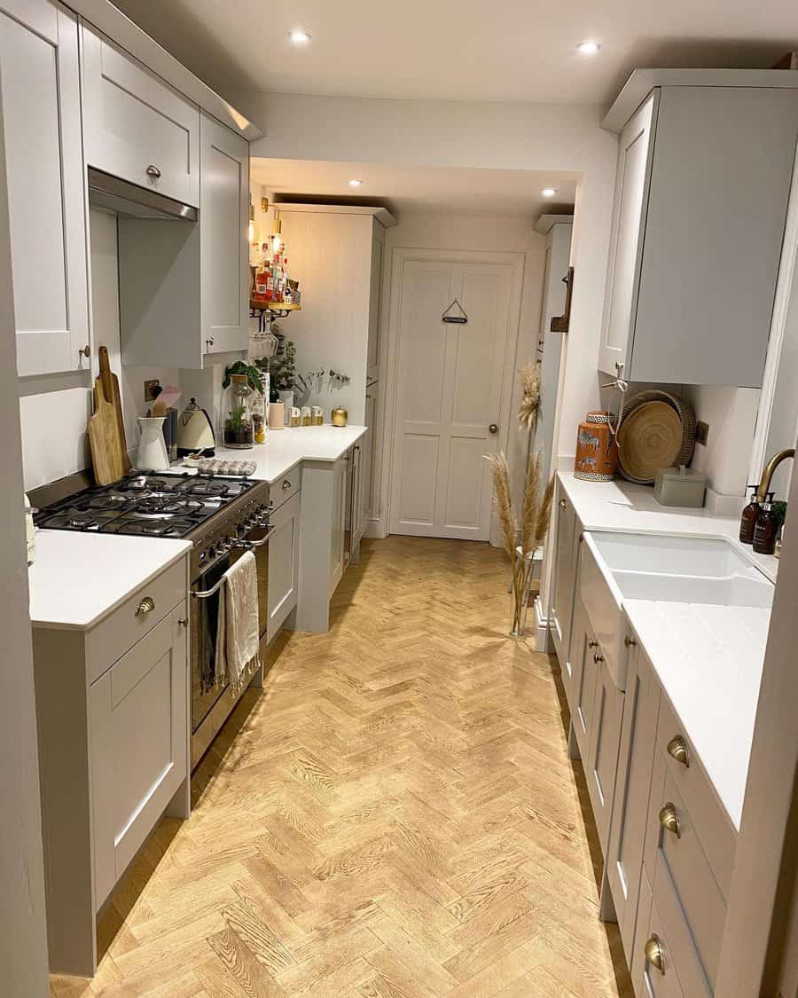 Minimalist kitchen with a tile floor and a sink