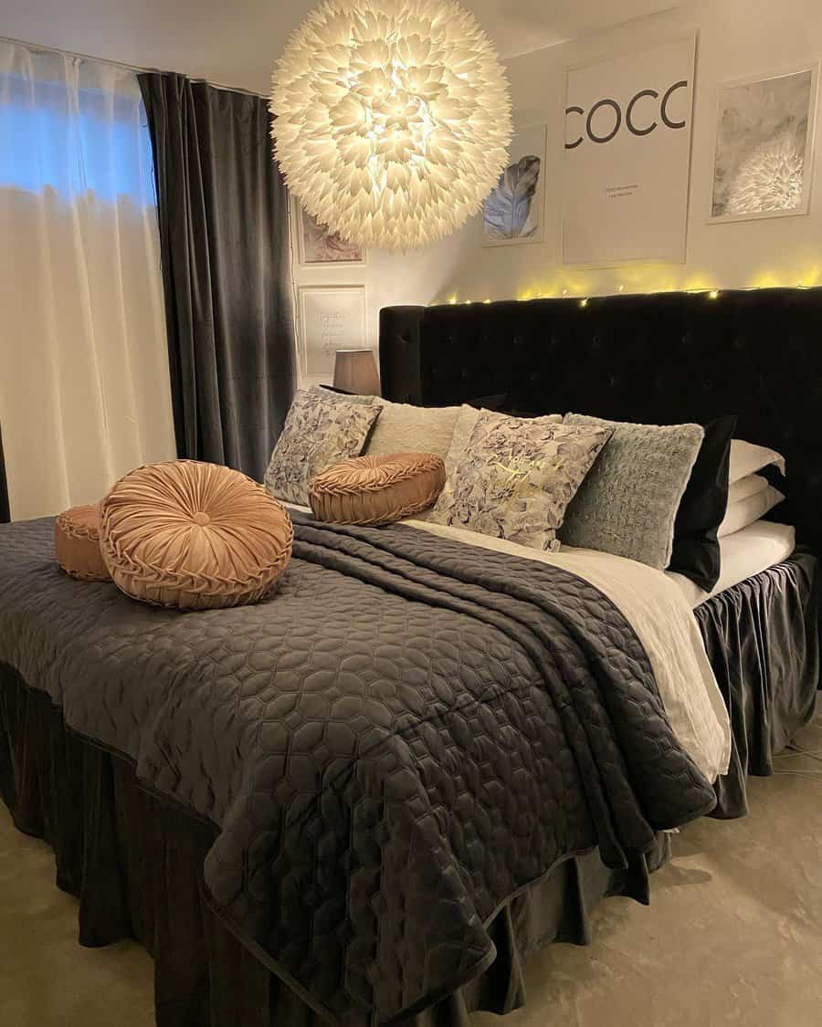 Stylish bedroom with dramatic lighting and luxury bedding