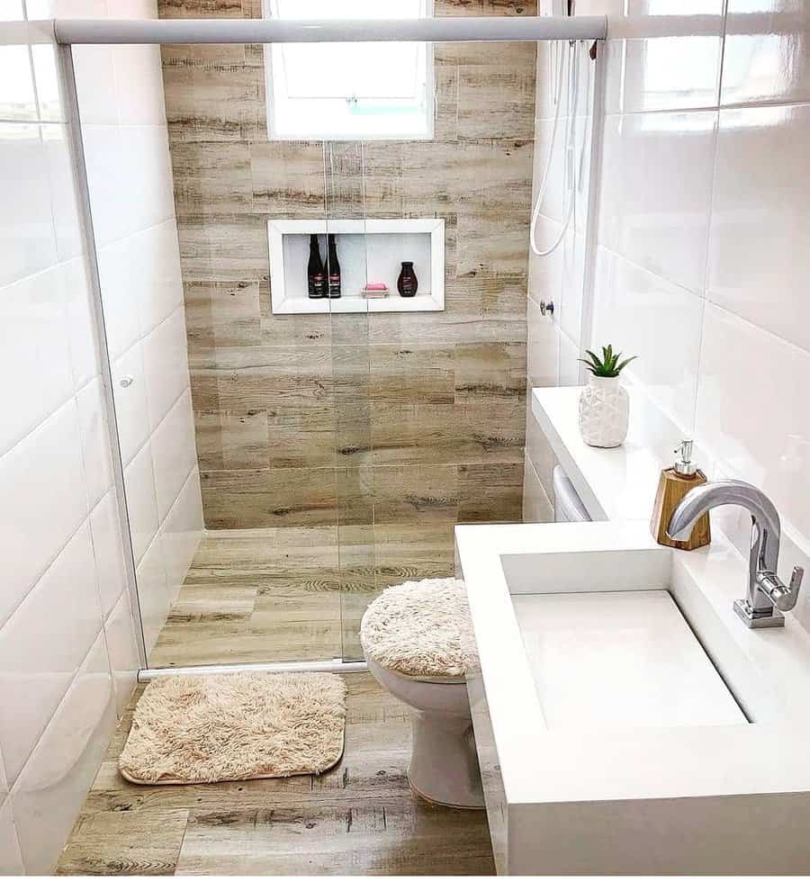 Small bathroom with off-white walls and wood tile flooring