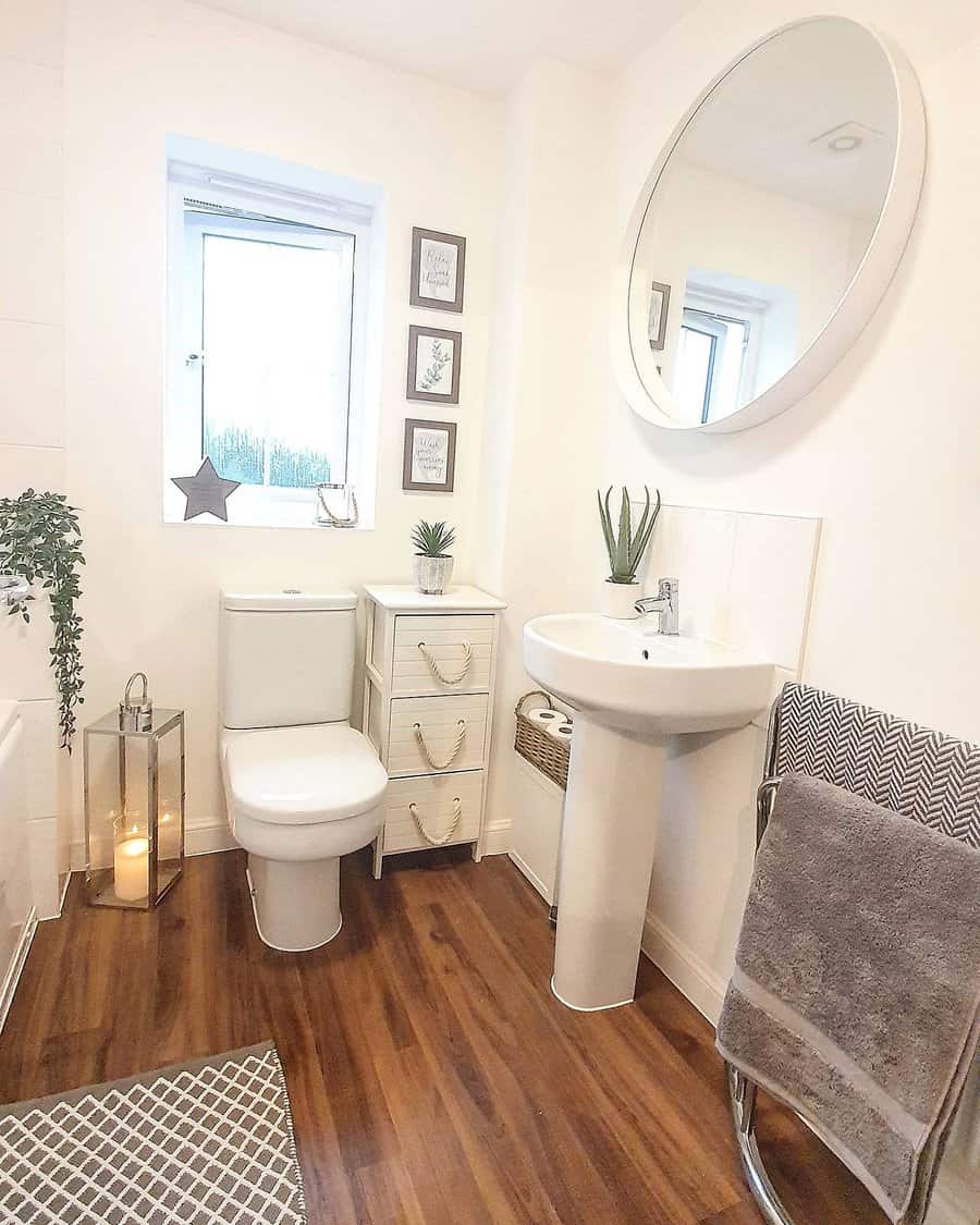 Small bathroom with wood flooring 