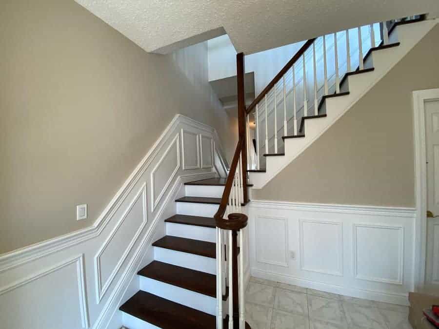 Traditional staircase with white walls and wooden steps