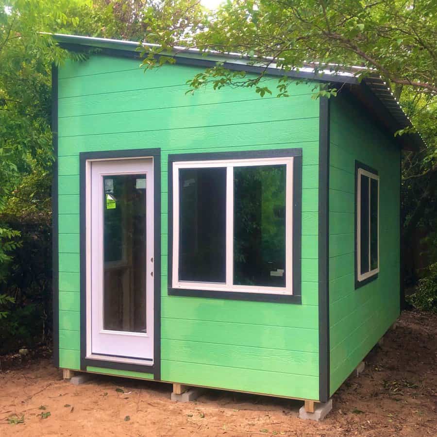 Green and black garden shed 