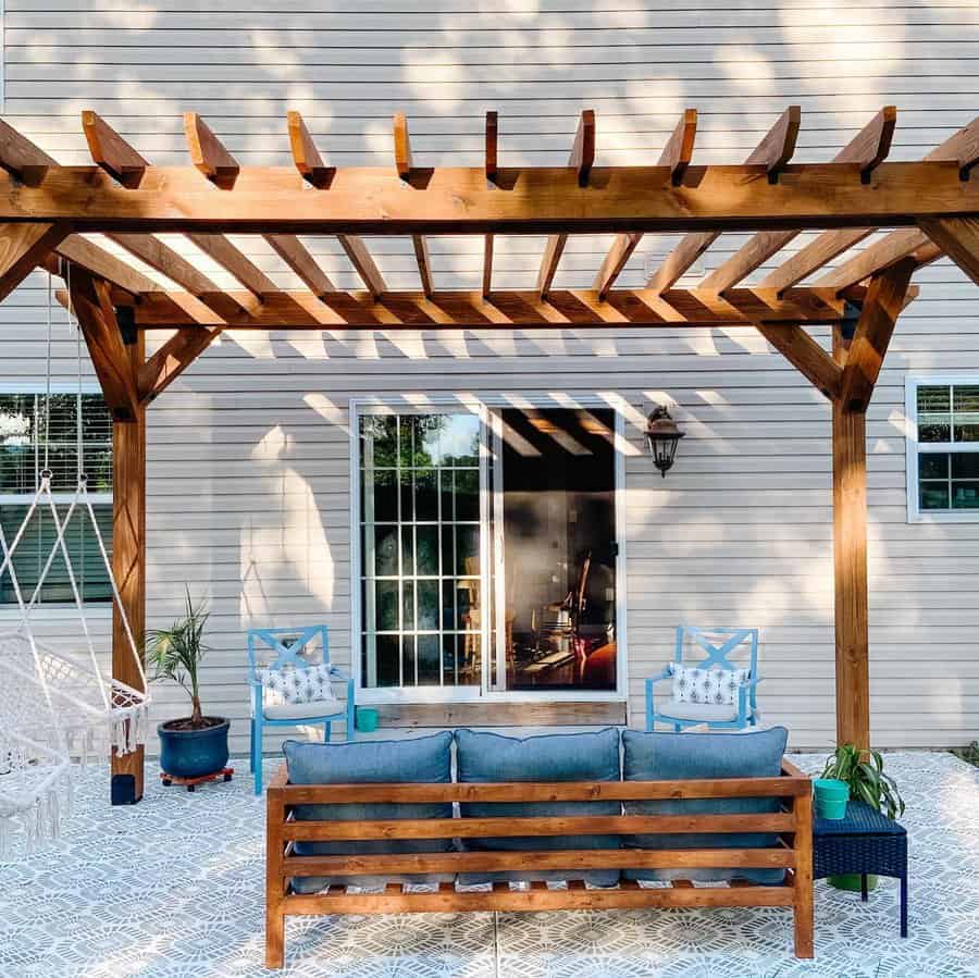 Backyard pergola with wood furniture