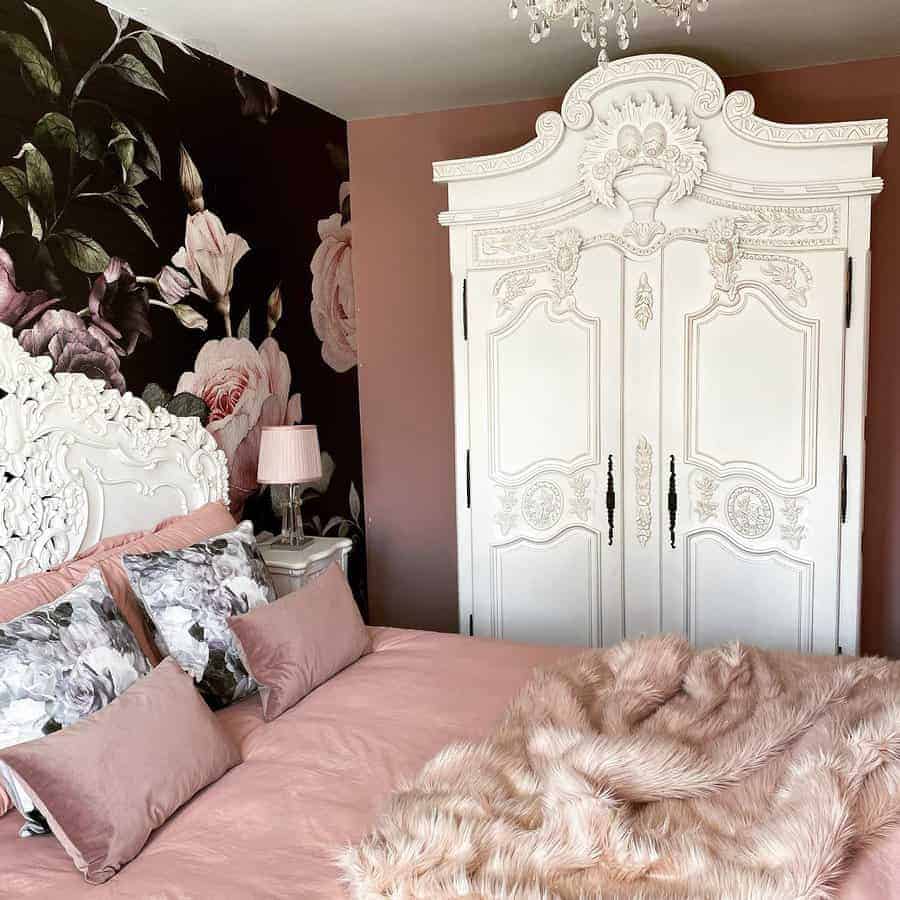 Vintage bedroom with floral wallpaper and pink hues