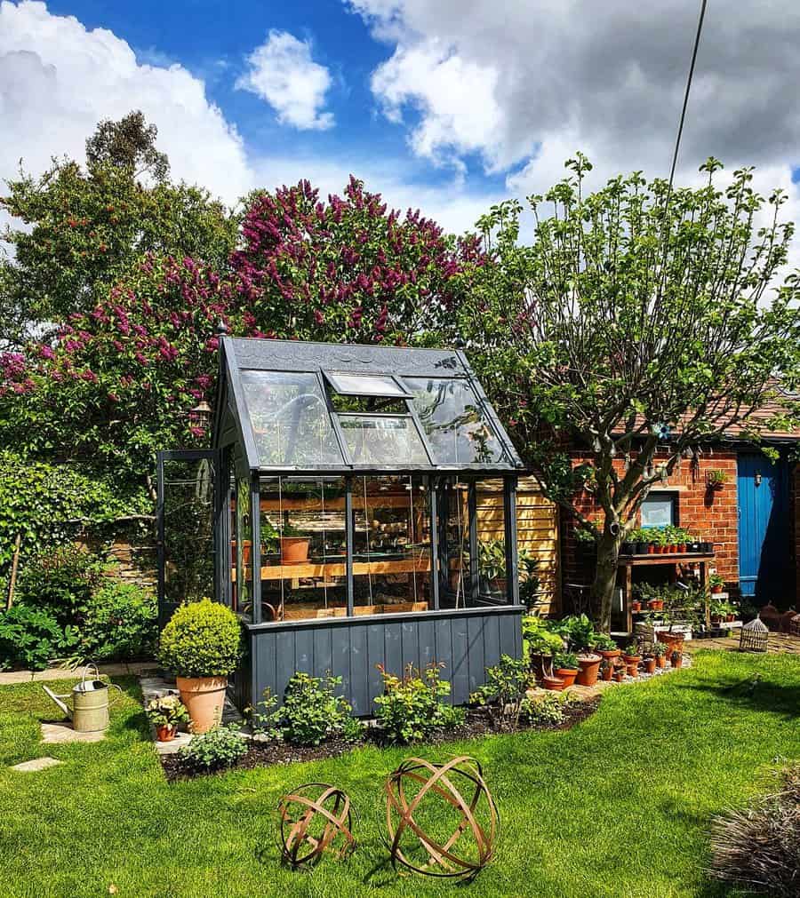 Front yard wooden greenhouse