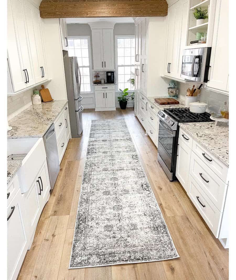 Rustic kitchen with a vintage rug and beam