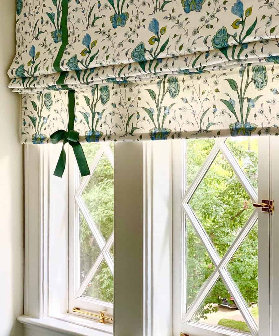 Floral Roman shade with ribbon detail on window