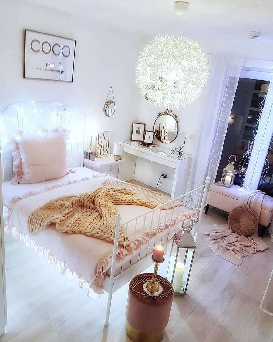 Soft pink bedroom with unique light fixture and decor