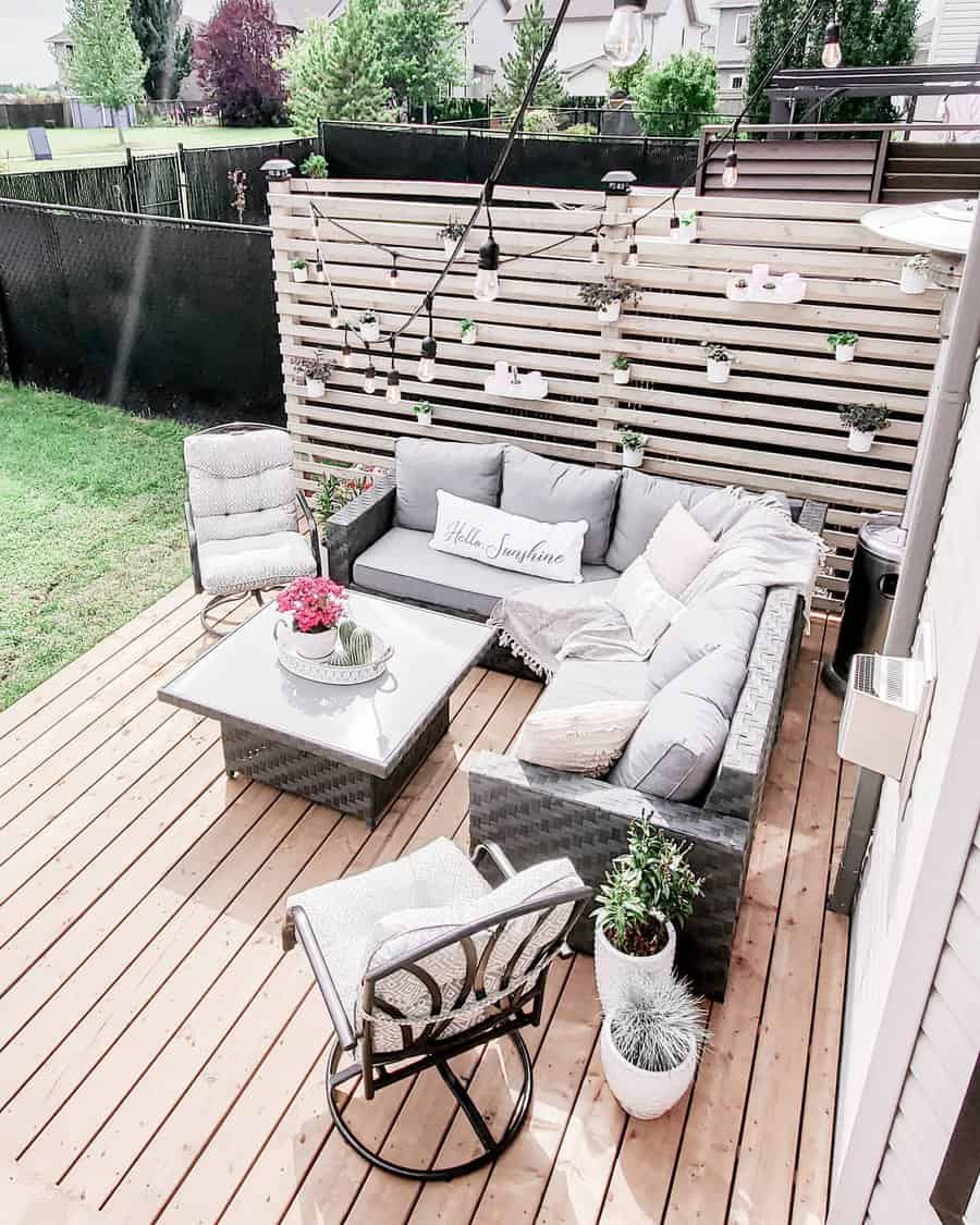 Patio with hanging string lights and cozy sofa