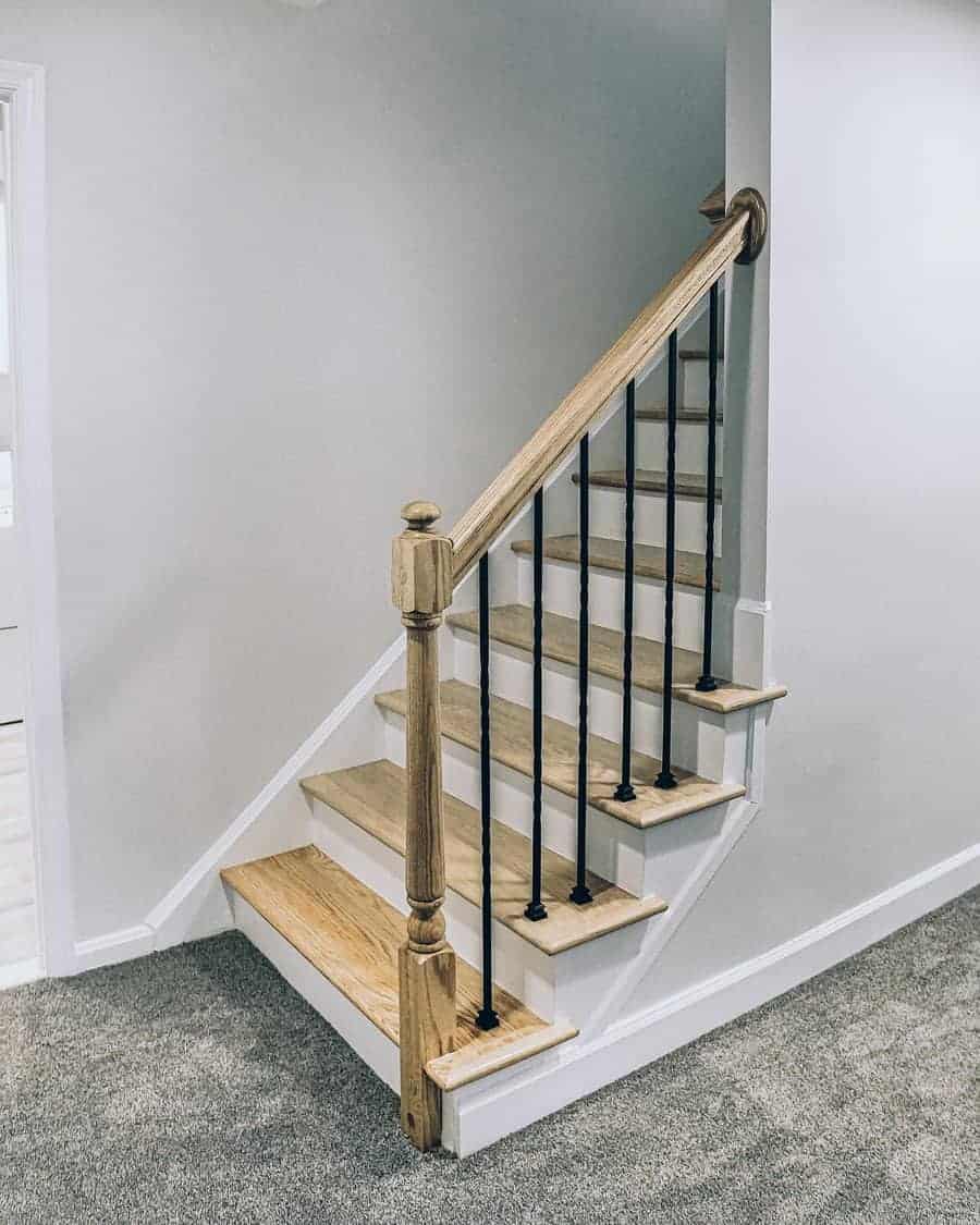 Classic staircase with wood handrails and metal baluster