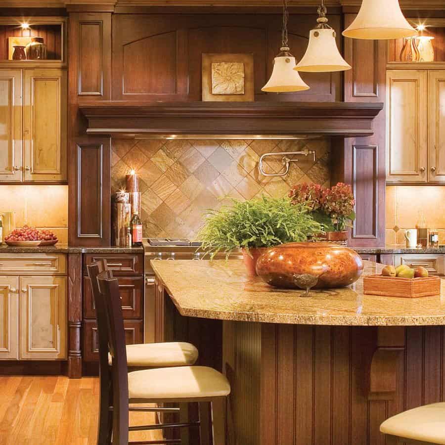 Warm rustic kitchen with wood cabinets and bell pendants