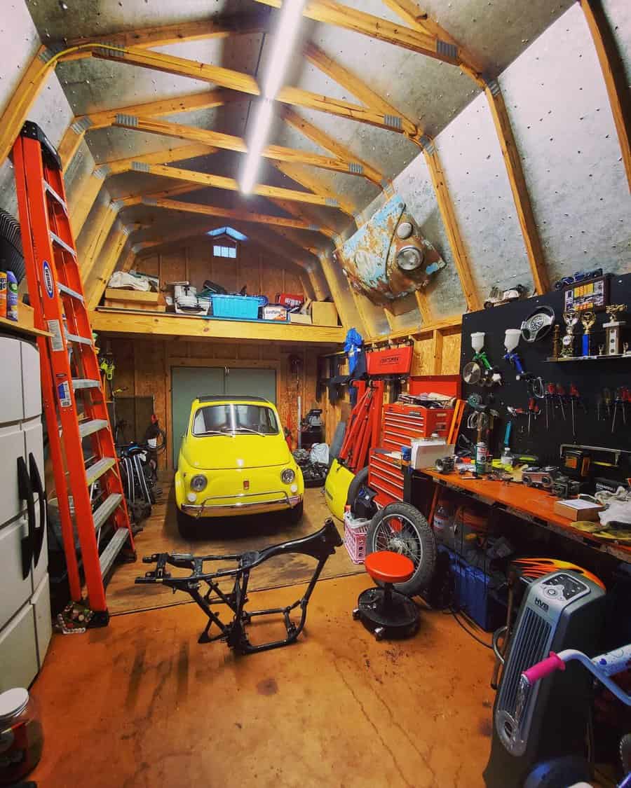 Vintage yellow car in a rustic garage with wooden beams